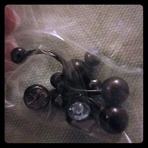 Multiple black curved barbells (belly button ring)